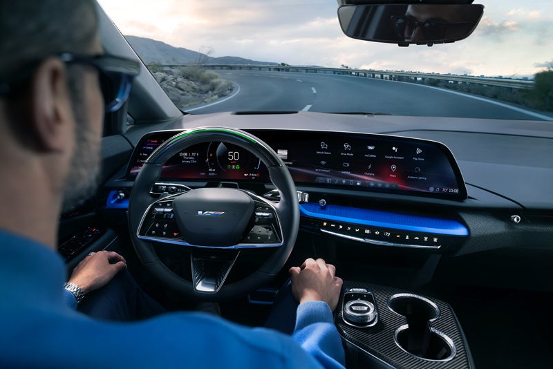 Front View of the 2026 OPTIQ-V Driving Through the Dusk Utilizing its Headlights | Rick Bokman Inc. in OLEAN NY