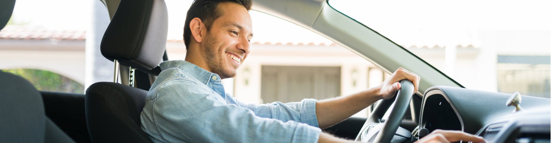 Man driving his new car
